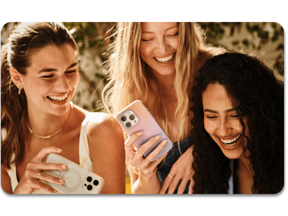 Group of girls smiling with cute and stylish iPhone cases